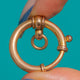 Edwardian Gold-plated bolt ring clasp, close front view of the raised collars and jump ring