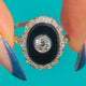 Platinum Onyx target ring, front with central Diamond and scalloped halo