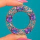 Silver Amethyst Floral Roundel Pendant, front view of five Amethysts and floral Silverwork